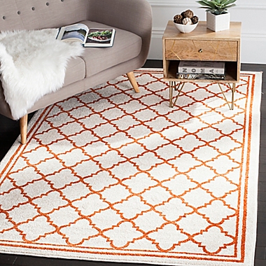 Safavieh Amherst 5-Foot x 8-Foot Quine Indoor/Outdoor Area Rug in Beige/Orange. View a larger version of this product image.