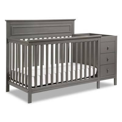 gray baby crib with changing table