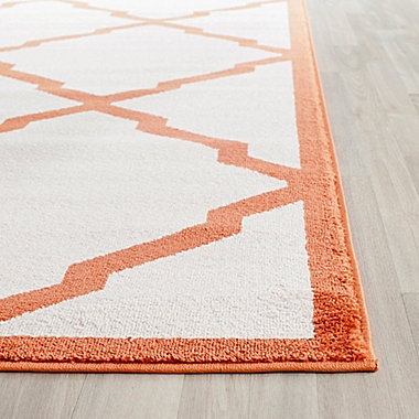 Safavieh Amherst Festival 5-Foot x 8-Foot Indoor/Outdoor Area Rug in Beige/Orange. View a larger version of this product image.