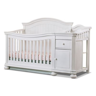 white crib with changing table
