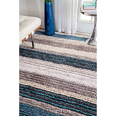 nuLOOM Hand Tufted Classie 9-Foot x 12-Foot Shag Area Rug in Blue. View a larger version of this product image.