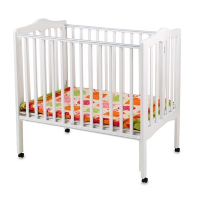 white portable crib