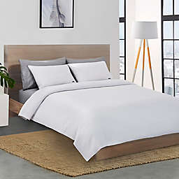 Lacoste™ Chevron Reversible Twin Coverlet in White