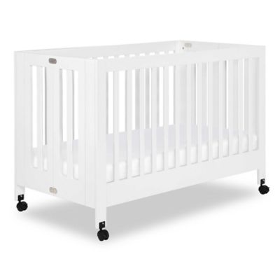 white portable crib