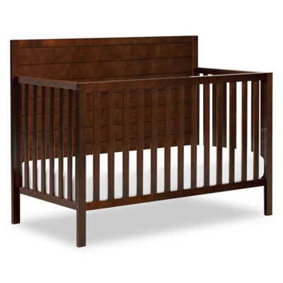 white upholstered crib