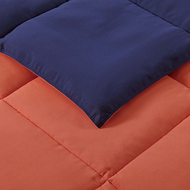 My World Solid Reversible 2-Piece Twin/Twin XL Comforter Set in Navy/Orange. View a larger version of this product image.