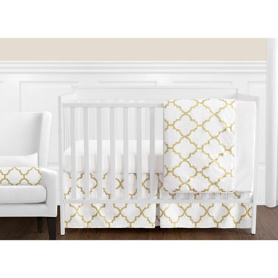 gold and white crib
