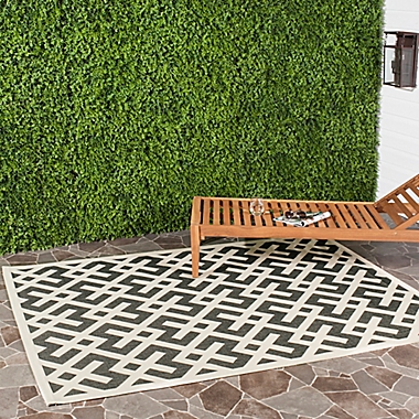 Safavieh Courtyard 8-Foot x 11-Foot Henley Indoor/Outdoor Rug in Black/Beige. View a larger version of this product image.