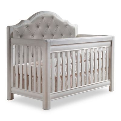 white tufted crib