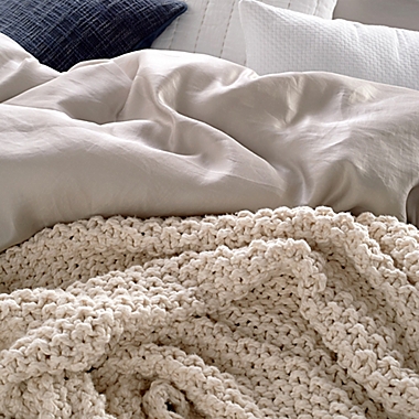 DKNYpure&reg; Silky Chunky Knit Throw Blanket in Natural. View a larger version of this product image.