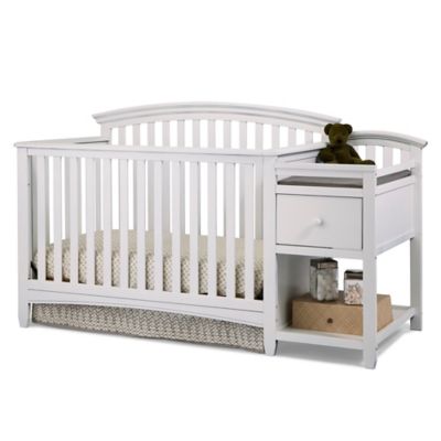 white baby crib with changing table