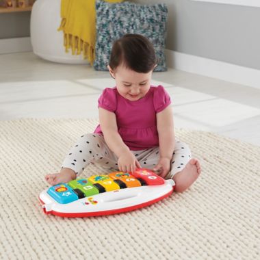 Fisher-Price&reg; Deluxe Kick and Play Piano Gym in Green. View a larger version of this product image.