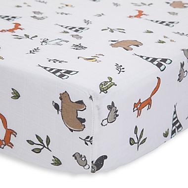 Little Unicorn Forest Friends Cotton Muslin Fitted Sheet in Brown/Orange. View a larger version of this product image.