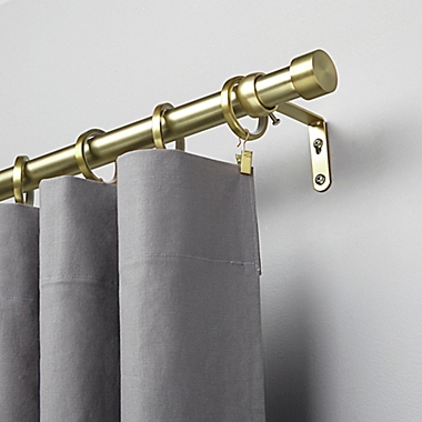 Umbra&reg; Cappa 66 to 120-Inch Adjustable Curtain Rod in New Brass. View a larger version of this product image.