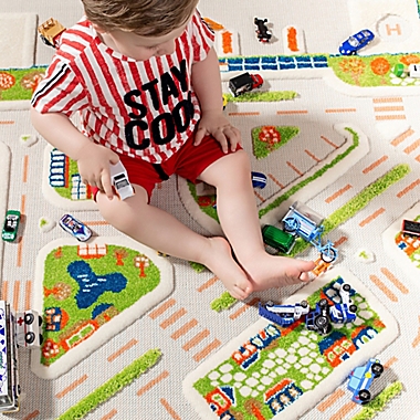 IVI Mini City 3&#39;3" x 4&#39;11" 3-Dimensional Play Rug in Blue. View a larger version of this product image.