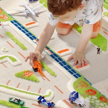IVI Mini City 3&#39;3" x 4&#39;11" 3-Dimensional Play Rug in Blue. View a larger version of this product image.