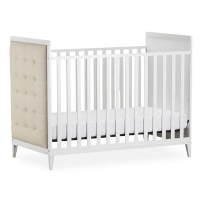 white upholstered crib