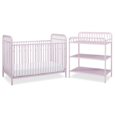 pink crib with changing table