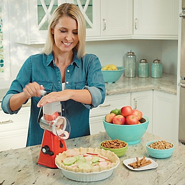 NutriSlicer&trade; 3-in-1 Spinning/Rotating Mandoline and Countertop Food Slicer in Red. View a larger version of this product image.