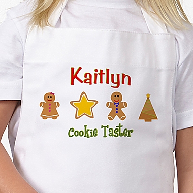 Lil&#39; Christmas Baker Kid&#39;s Apron in White/Pink. View a larger version of this product image.