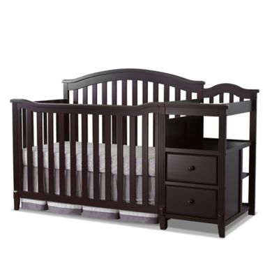 brown crib with changing table