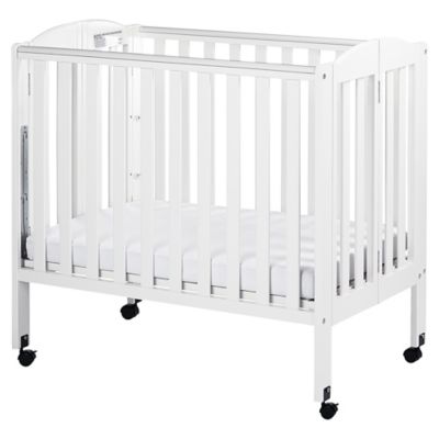 white portable crib