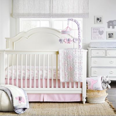 white and pink crib
