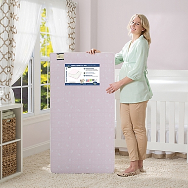 Serta&reg; Perfect Embrace Crib and Toddler Mattress in Pink. View a larger version of this product image.