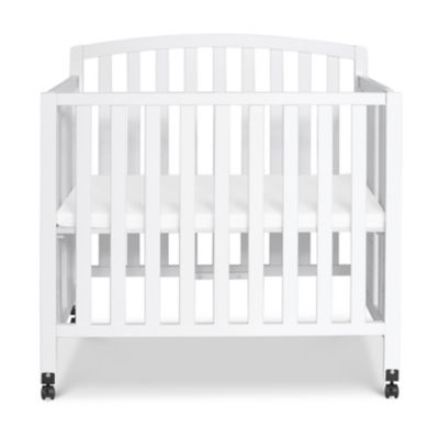 white mini crib
