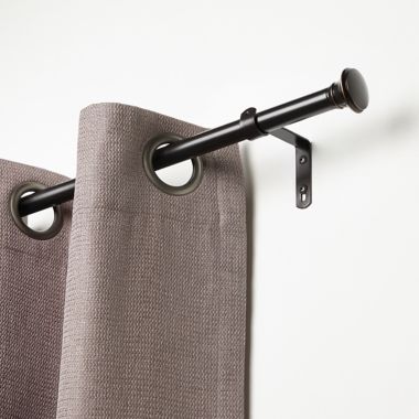 Umbra&reg; Cafe 84 to 120-Inch Adjustable Curtain Rod in Bronze. View a larger version of this product image.