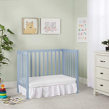 Dream On Me Edgewood 4-in-1 Convertible Mini Crib in Dusty Blue. View a larger version of this product image.