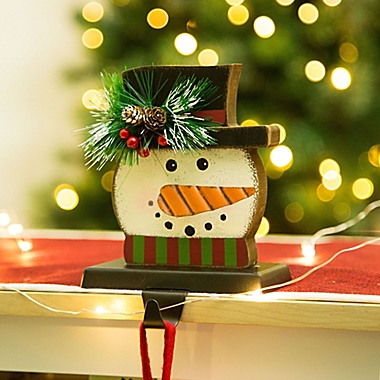 Glitzhome&reg; Snowman Head Stocking Holder in White. View a larger version of this product image.