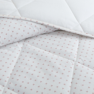 UGG&reg; Juvie 2-Piece Twin Flannel Comforter Set in Peach Hearts. View a larger version of this product image.