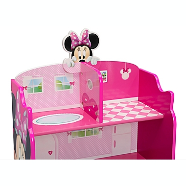 Delta Children&reg; Disney&reg; Minnie Mouse Wooden Playhouse 4-Shelf Bookcase in Pink. View a larger version of this product image.