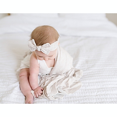Copper Pearl&trade; Newborn Oat Knot Bow Headband in Cream. View a larger version of this product image.