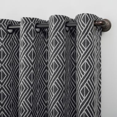 Scott Living Gresham Geometric Total Blackout 96-Inch Grommet Curtain Panel in Black (Single). View a larger version of this product image.
