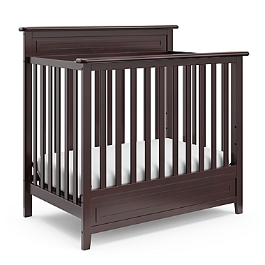 Storkcraft Petal Mini 4-in-1 Crib with Mattress in Espresso. View a larger version of this product image.