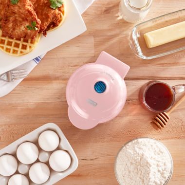 Dash&reg; Mini Waffle Maker in Pink. View a larger version of this product image.