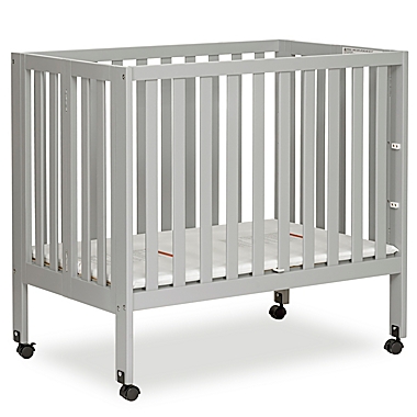 Dream On Me Jett Mini Portable Folding Crib in Pebble Grey. View a larger version of this product image.