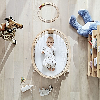 Stokke&reg; Sleepi&trade; Mini with Drape Rod and Mattress in Hazy Grey. View a larger version of this product image.