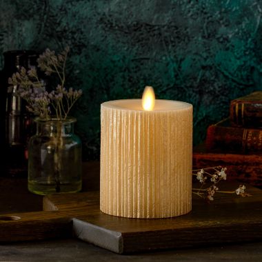 Luminara&reg; Moving Flame&reg; 4.5-Inch Gold Ribbed Real-Flame Effect Pillar Candle. View a larger version of this product image.