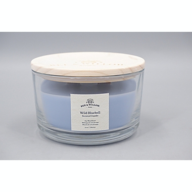 Bee &amp; Willow&trade; Wild Bluebell 14 oz. Wood-Wick Glass Candle. View a larger version of this product image.