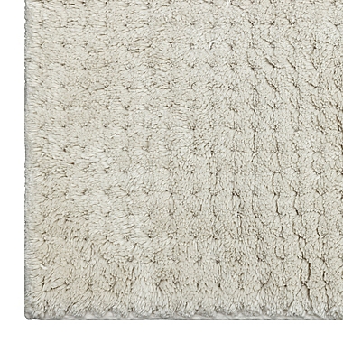 Haven&trade; 21&quot; x 34&quot; Organic Cotton Tufted Waffle Bath Rug in Pumice Tan. View a larger version of this product image.