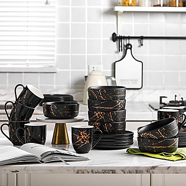 Stone Lain Gold Splash 16-Piece Dinnerware Set in Gold/Black. View a larger version of this product image.