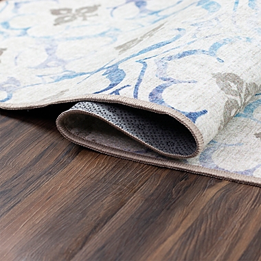 My Magic Carpet Leilani Damask Washable 5&#39; x 7&#39; Area Rug in Beige/Blue. View a larger version of this product image.