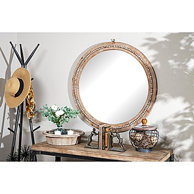 Ridge Road Decor Natural 36-Inch Round Wooden Wall Mirror with Decorative Beads in Light Brown. View a larger version of this product image.