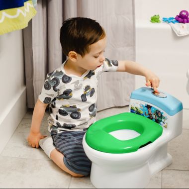 The First Years Disney Pixar&reg; Toy Story&trade; Potty and Trainer Seat in Green. View a larger version of this product image.