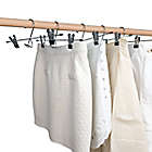 Alternate image 1 for Simply Essential&trade; Skirt/Pant Hangers with Clips in Chrome/Black (Set of 4)