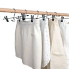 Alternate image 1 for Simply Essential&trade; Skirt/Pant Hangers with Clips in Chrome/Black (Set of 4)