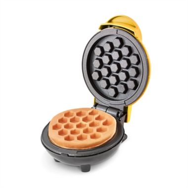 Dash&reg; Honeycomb Mini Waffle Maker in Yellow. View a larger version of this product image.